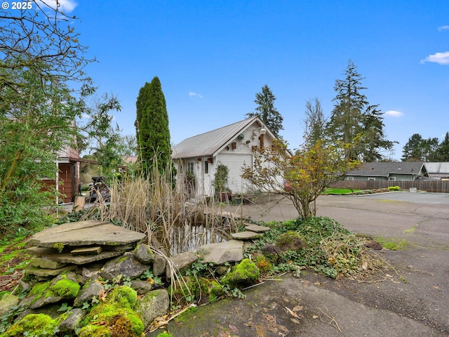 510 SE Shafford St, Estacada, OR 97023 - view of side of property with metal roof and fence