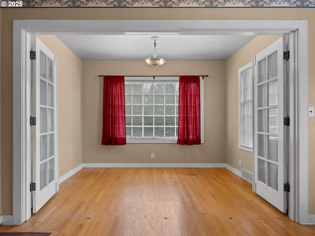 510 SE Shafford St, Estacada, OR 97023 - unfurnished dining area featuring wood finished floors, baseboards, and visible vents