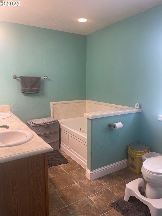 bathroom with tile flooring, double vanity, a washtub, and toilet