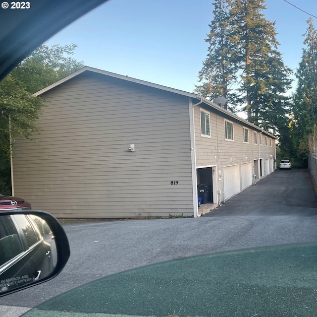 view of property exterior featuring a garage