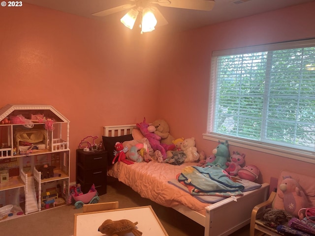 carpeted bedroom with ceiling fan