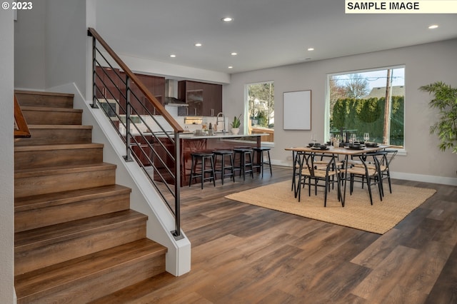 dining space featuring sink and dark hardwood / wood-style floors