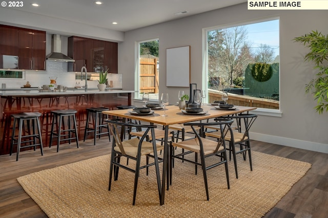 dining area featuring dark hardwood / wood-style floors