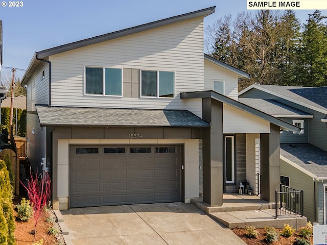 view of front of property with a garage