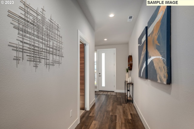 hall with dark hardwood / wood-style floors