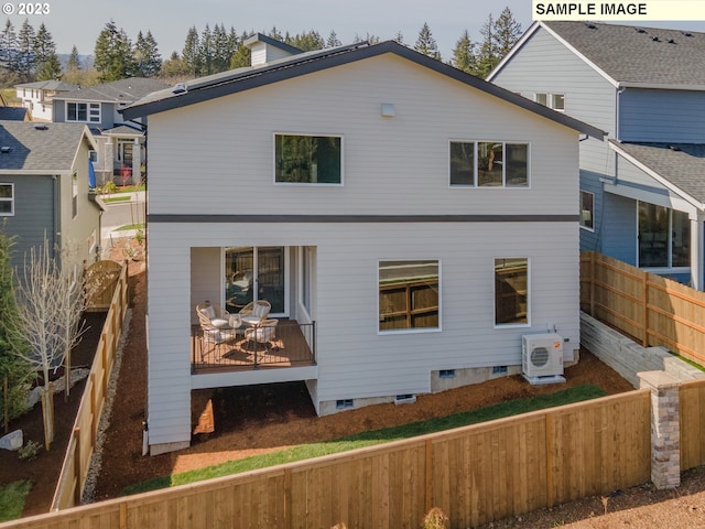 back of house featuring ac unit and a wooden deck