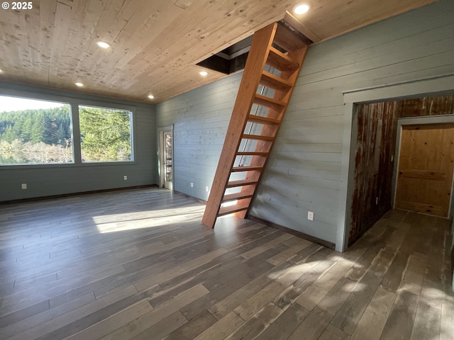 unfurnished room featuring stairs, recessed lighting, wood ceiling, and dark wood-style flooring