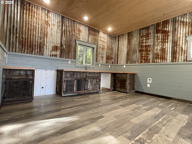 bar with recessed lighting, wooden ceiling, a fireplace, wood-type flooring, and a sink