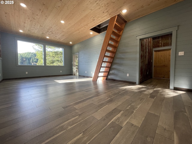 unfurnished living room featuring stairway, recessed lighting, wooden ceiling, and hardwood / wood-style flooring