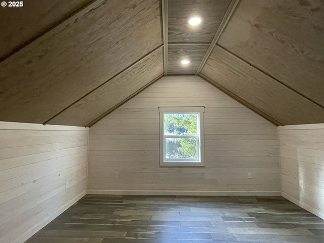 bonus room with wooden walls, recessed lighting, lofted ceiling, and wood finished floors