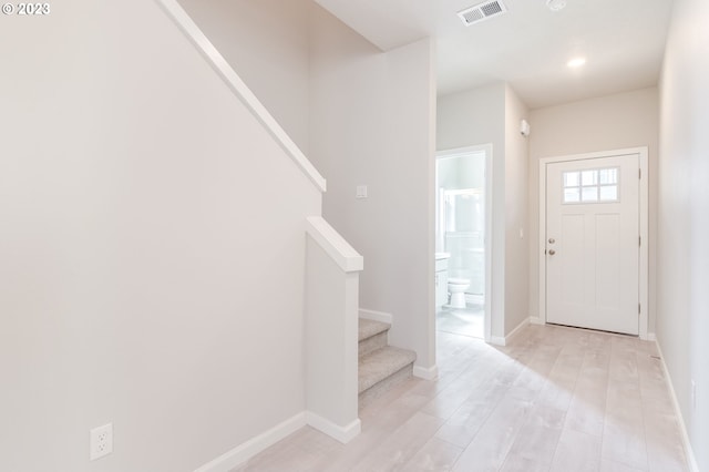 foyer entrance with light hardwood / wood-style floors