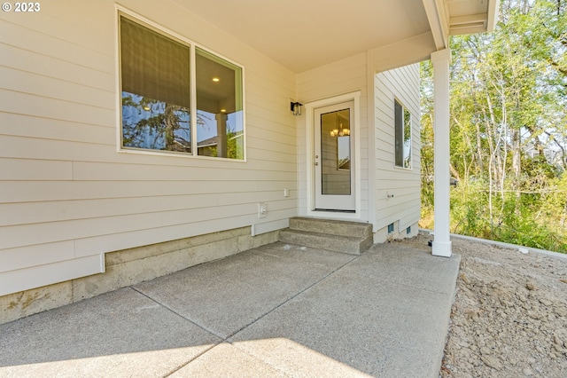 property entrance featuring a patio