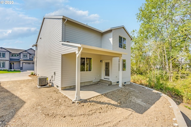 view of front of home featuring central air condition unit