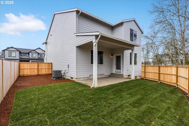 rear view of property with a yard, a patio area, and central air condition unit