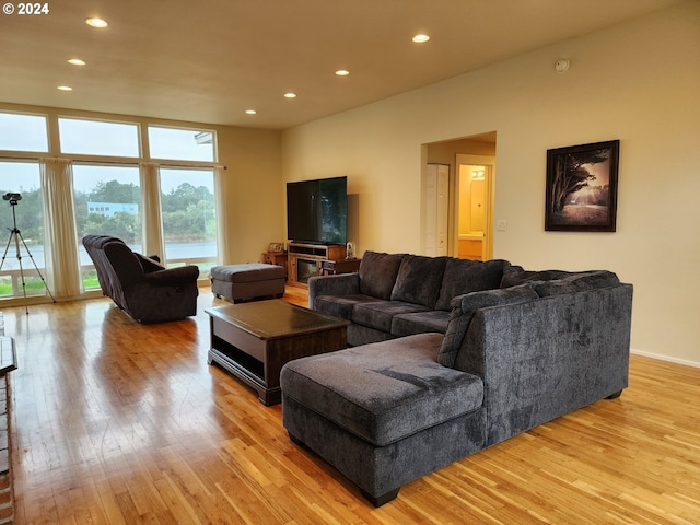 living area with recessed lighting and light wood-type flooring