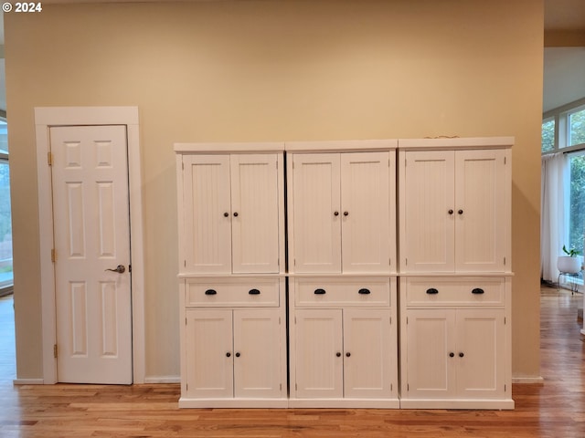 details with wood finished floors and baseboards