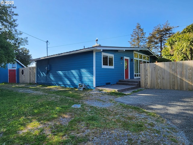 rear view of property with fence