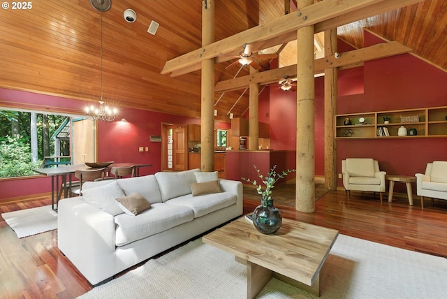 25901 E Highview Dr, Welches, OR 97067 - living area with wood ceiling, wood finished floors, decorative columns, ceiling fan, and a chandelier