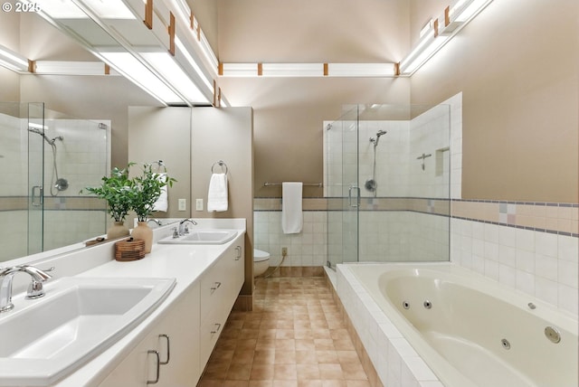 25901 E Highview Dr, Welches, OR 97067 - bathroom featuring a whirlpool tub, a shower stall, double vanity, and tile patterned flooring