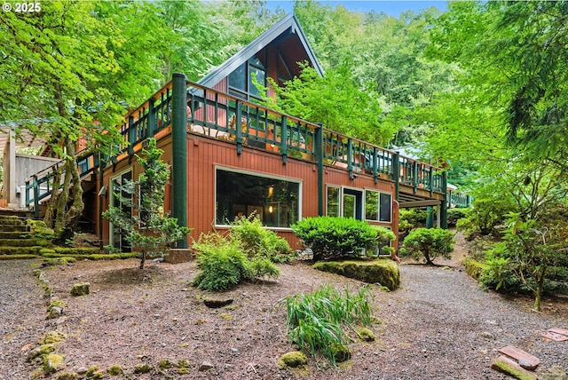 25901 E Highview Dr, Welches, OR 97067 - rear view of house with a wooden deck and stairway