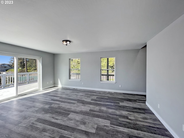 empty room featuring dark wood-type flooring