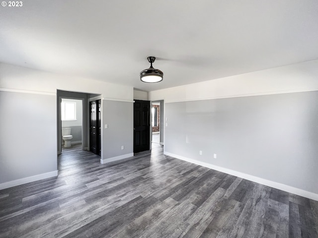 unfurnished room featuring dark hardwood / wood-style floors