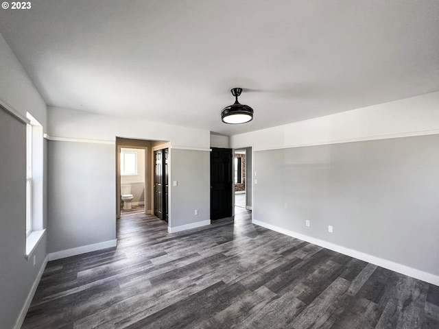 spare room featuring dark hardwood / wood-style flooring