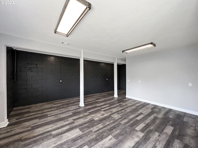 basement featuring dark wood-type flooring