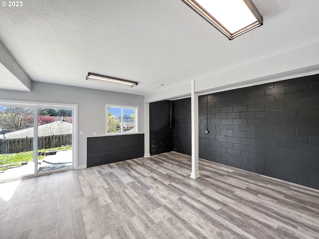 basement featuring light wood-type flooring