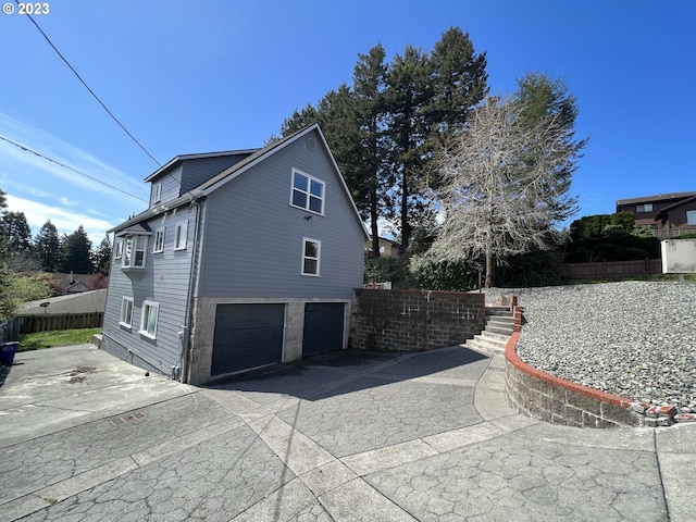 view of side of property featuring a garage