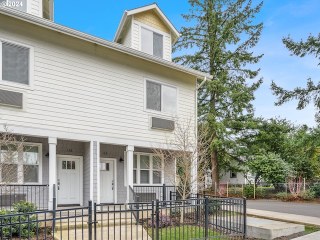 multi unit property featuring a porch