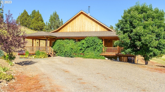 view of front facade with a wooden deck