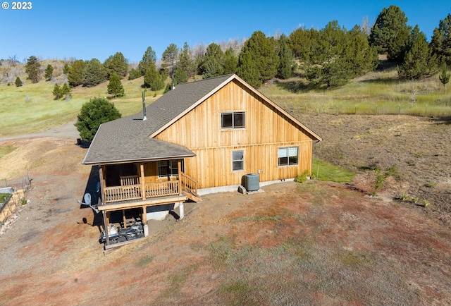 exterior space with central air condition unit and covered porch