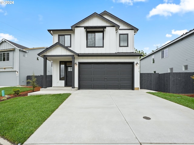 modern farmhouse style home with a garage and a front lawn