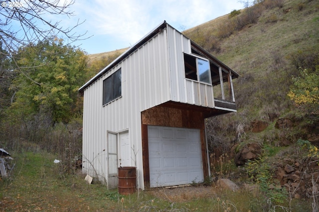 view of side of home with a garage