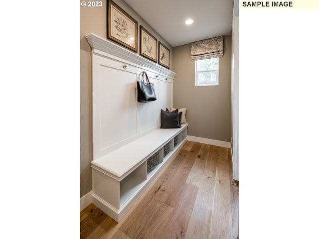 mudroom with light hardwood / wood-style floors