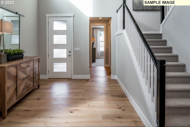 entrance foyer with light hardwood / wood-style floors