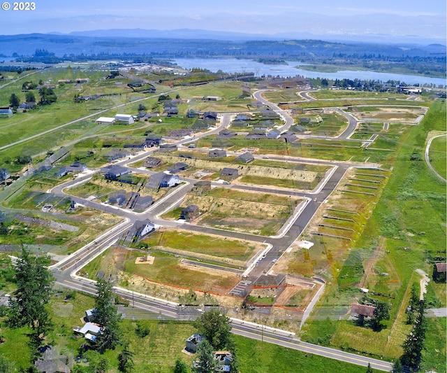 aerial view featuring a rural view and a water view