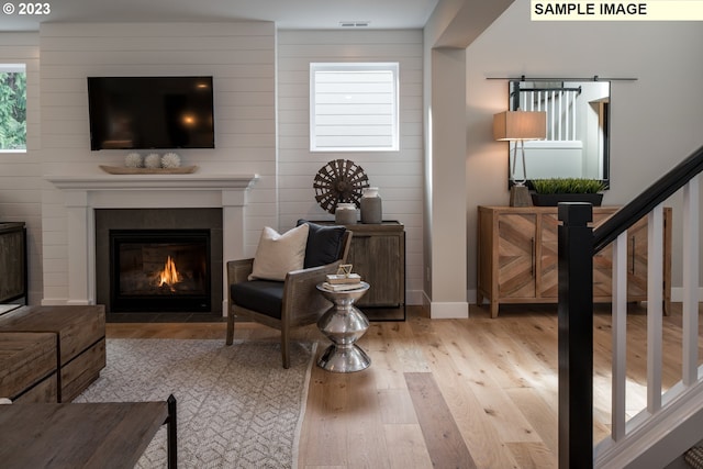 living room with light hardwood / wood-style flooring