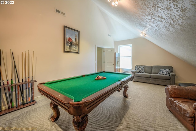 game room with billiards, lofted ceiling, a textured ceiling, and light colored carpet