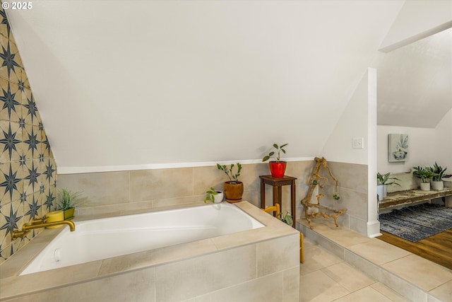 3045 SW Gaston Ave, Portland, OR 97239 - full bath featuring a garden tub, lofted ceiling, and tile patterned floors