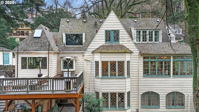 3045 SW Gaston Ave, Portland, OR 97239 - back of house featuring a deck and roof with shingles