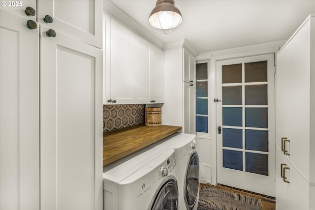 laundry area with cabinet space and washer and clothes dryer