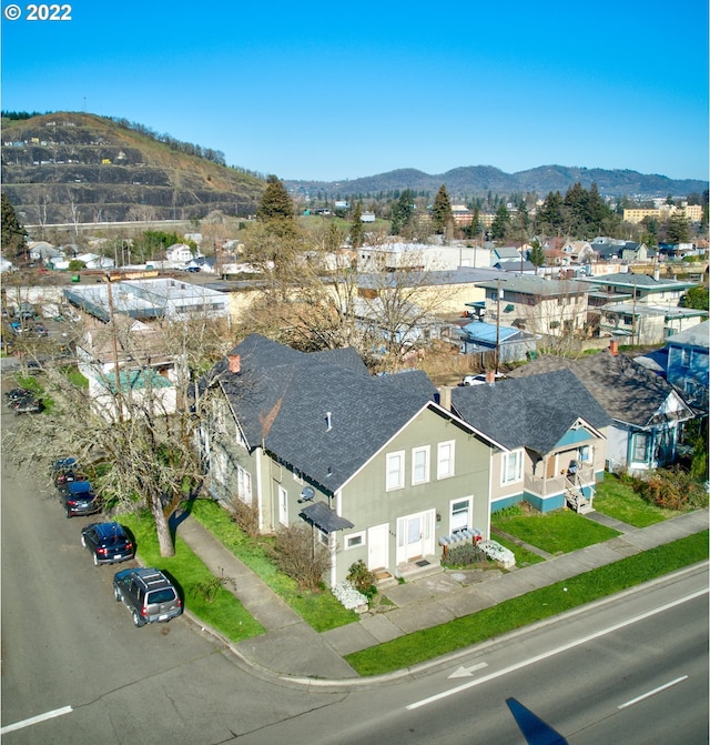 birds eye view of property featuring a mountain view