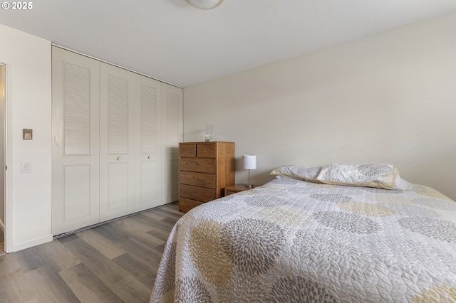 bedroom featuring wood finished floors and a closet
