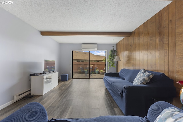 living area with a wall mounted AC, a baseboard heating unit, wood walls, beamed ceiling, and wood finished floors
