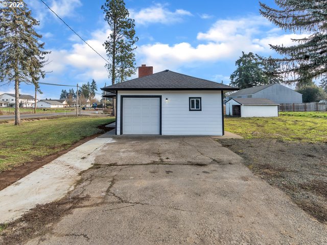 garage with a yard