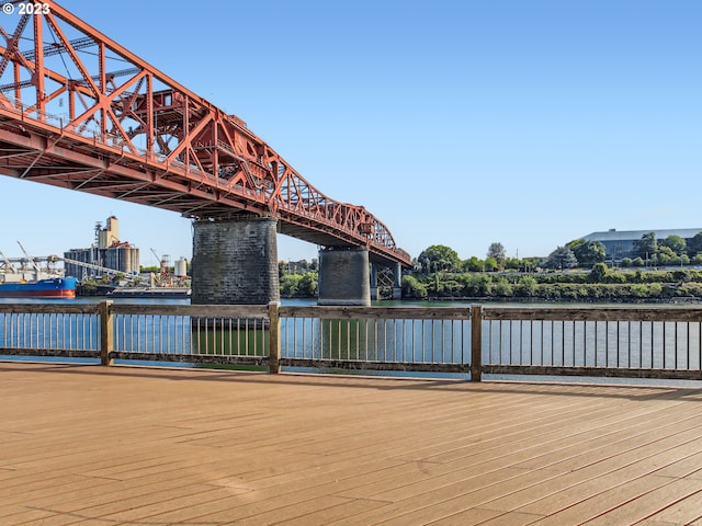 wooden terrace featuring a water view