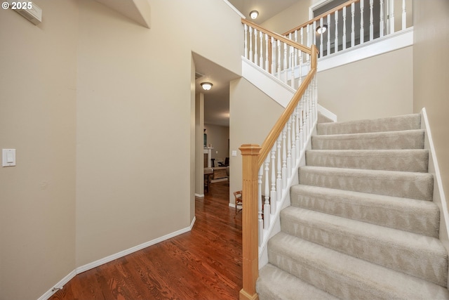 16713 NW Countryridge Dr, Portland, OR 97229 - stairway with wood finished floors and a towering ceiling