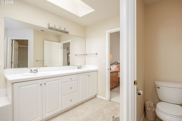 16713 NW Countryridge Dr, Portland, OR 97229 - bathroom with a skylight, double vanity, tile patterned floors, and ensuite bath